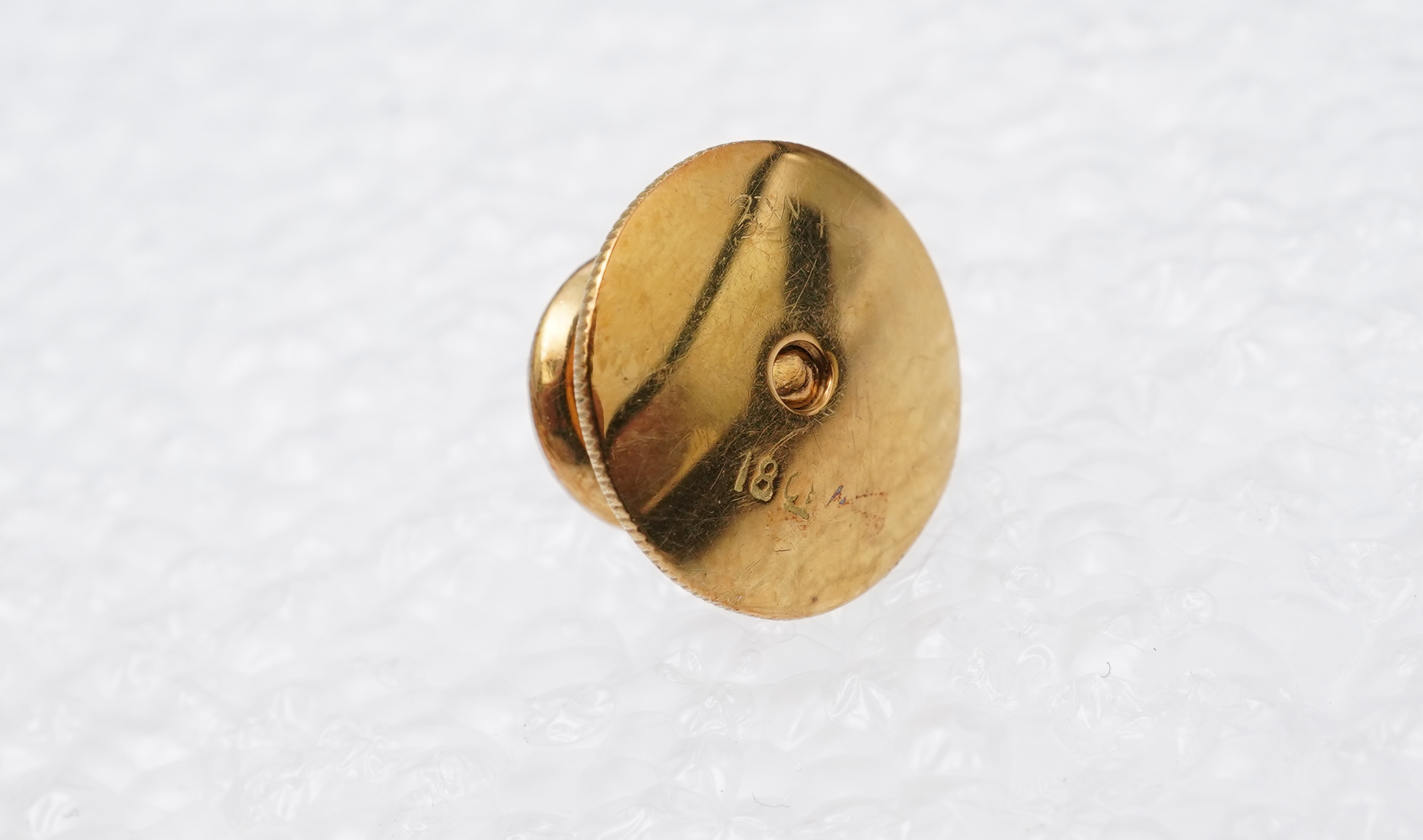 A collection of jewels and accessories, comprising: an onyx and diamond bar brooch, mounted in gold; a bangle set with a circular-cut diamond weighing approximately 0.07 carats, inner circumference approximately 17cm, st